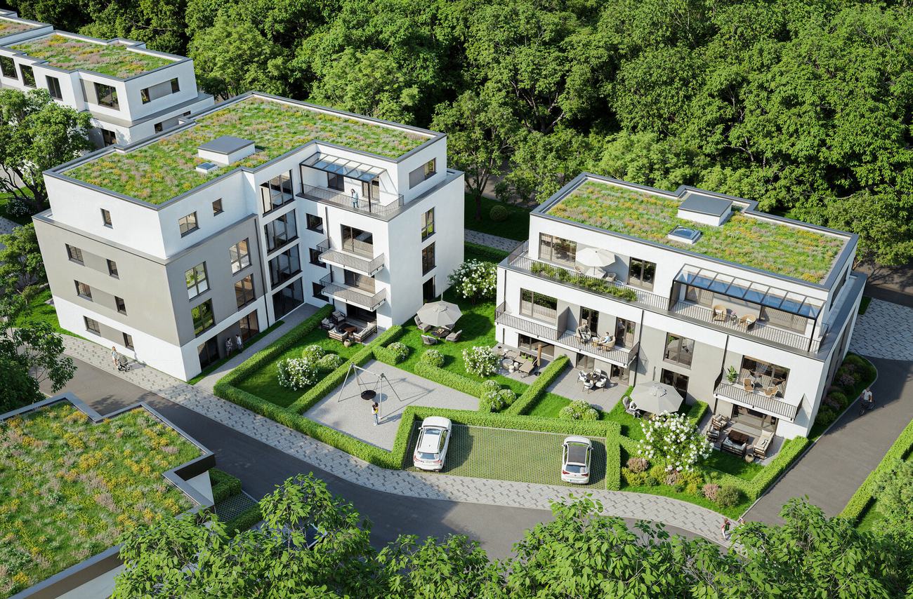 Luftbild der Wohnanlage mit begrünten Dächern und Gartenanlage